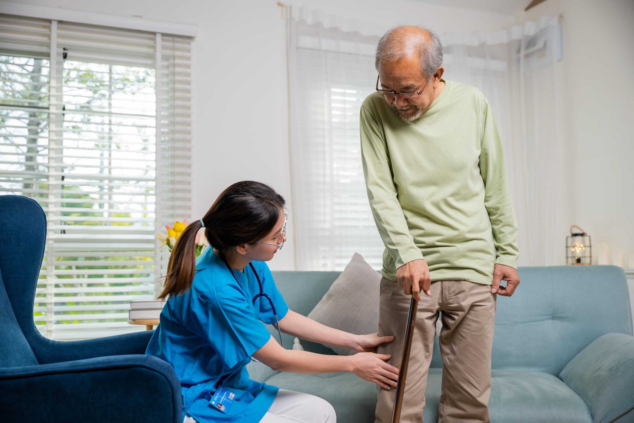 One of our mobile podiatry team treating a senior patient at home