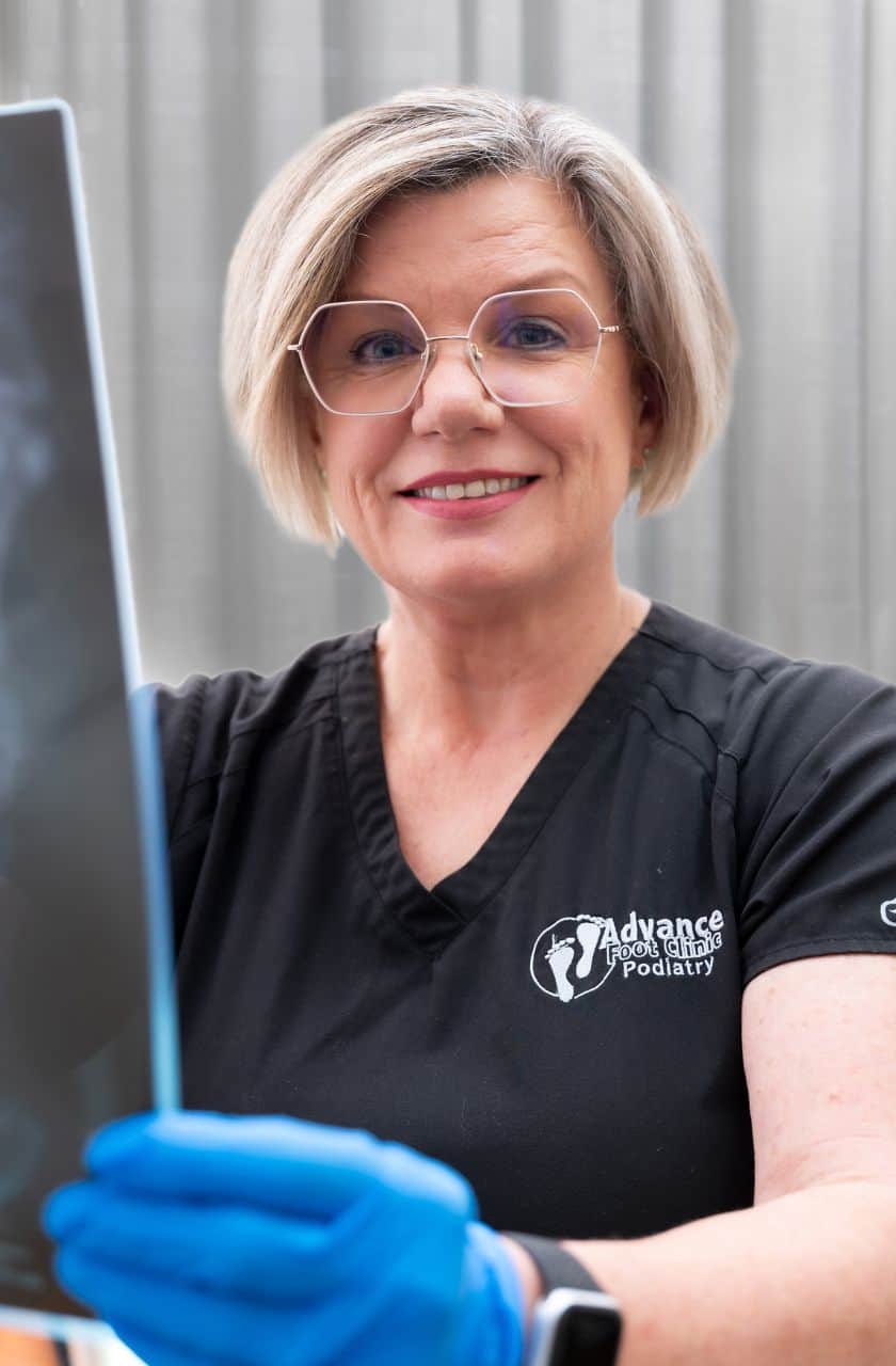 Best Podiatrist Angela Holland holding an x-ray