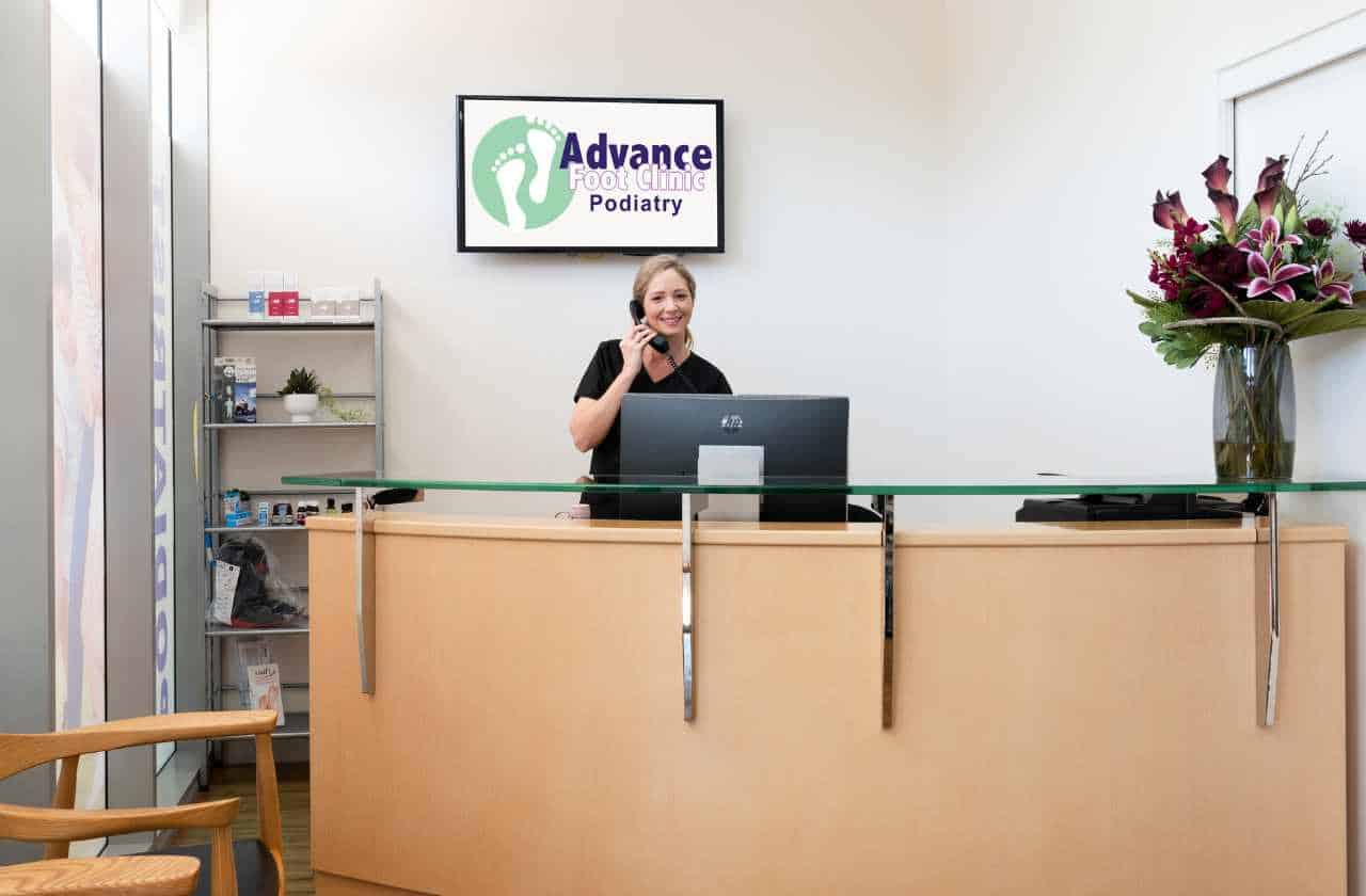 Receptionist welcoming patients