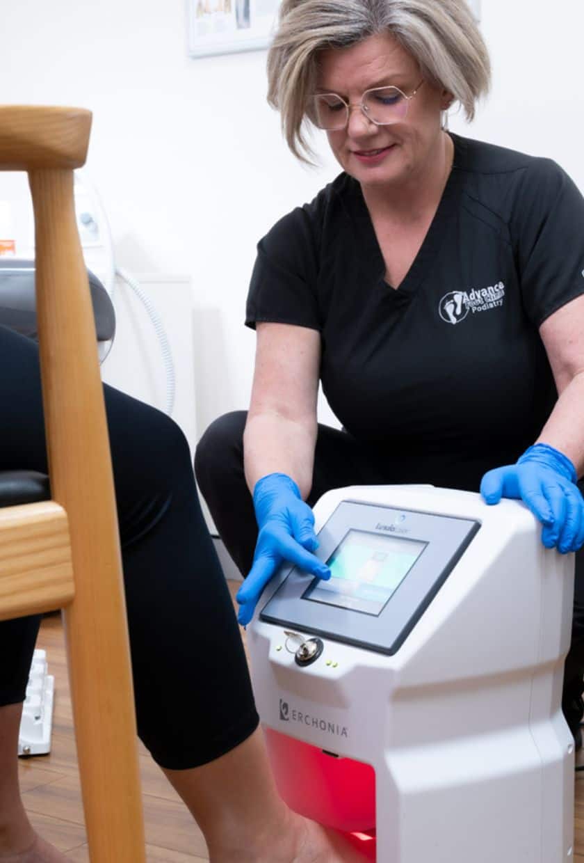 Podiatrist Angela Holland doing a Lunula laser treatment on a patient with fungal toenails