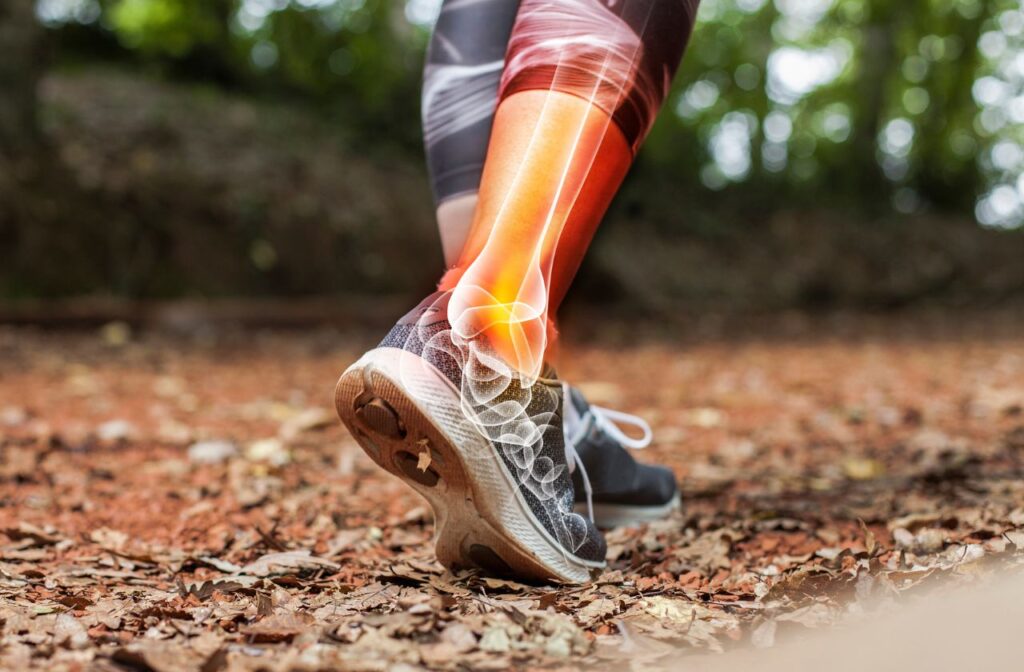 a close up of a persons feet and lower legs running with an overlay showing biomechanical problems